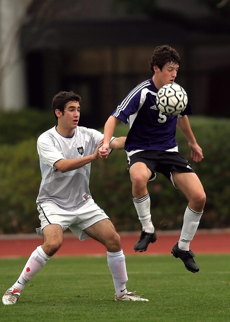 soccer, football, player, sport, ball, game, field, grass, boy, competition, action, soccer player, sports balls, soccer ball, active, football team, football game, soccer team, nature, football player, school, competitive